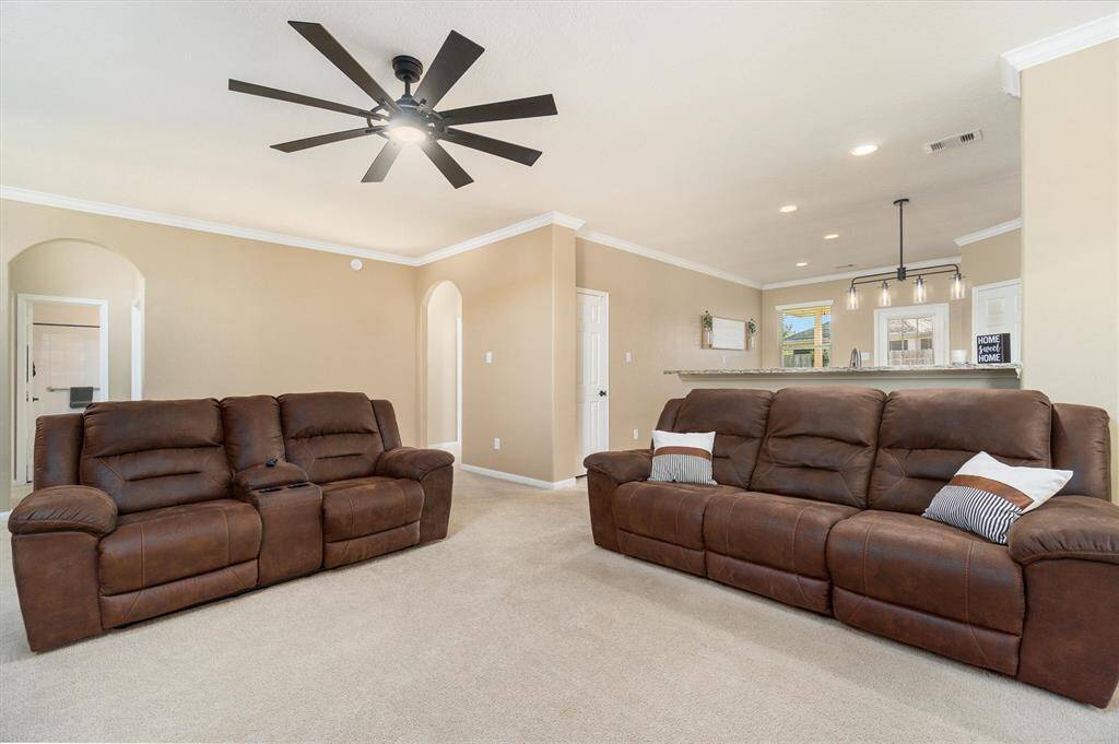 Living room with bar area overlooking the kitchen