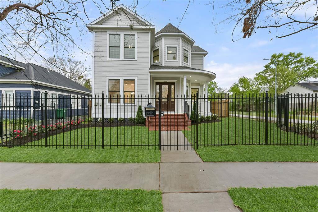 Charming two-story Victorian home with a classic design in the heart of Houston Heights featuring a welcoming front porch, beautiful, lush landscaping, and large windows. Ideal for those seeking a blend of elegance and comfort.
