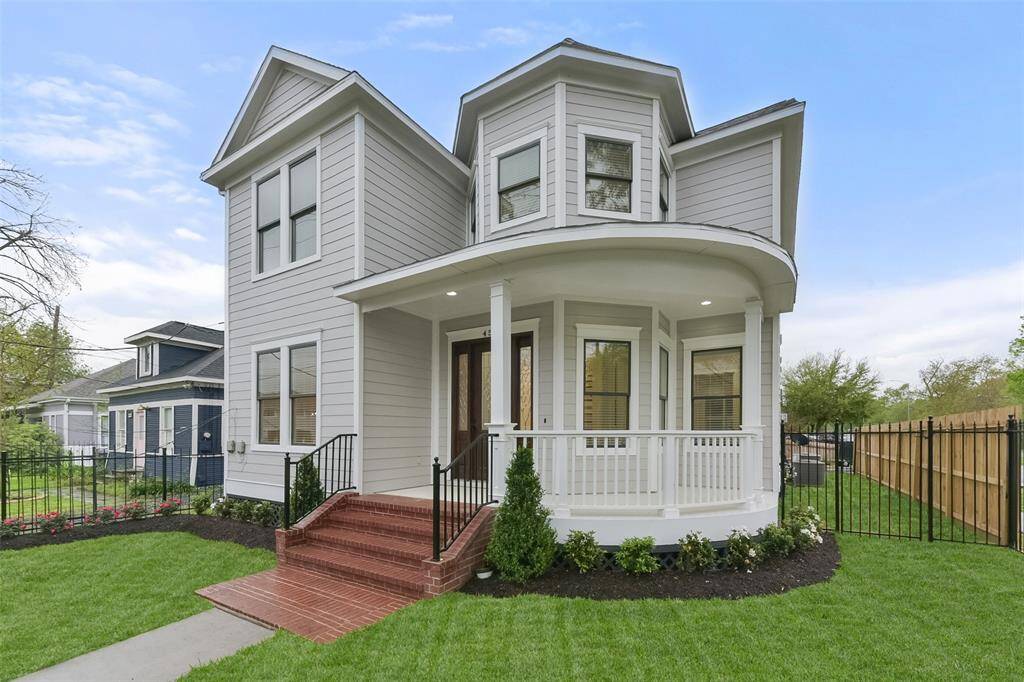 Beautiful Victorian home with lush landscaping.