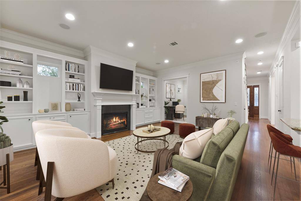 Another view of the cozy, light-filled family room open to the study and the kitchen.
