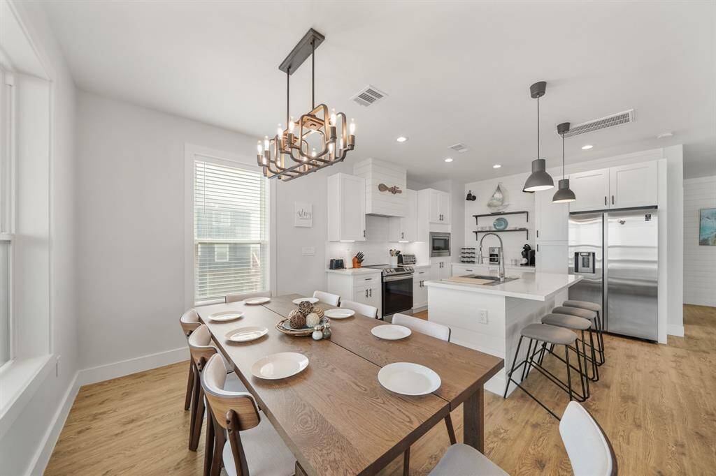 The room is enhanced by acaptivating chandelier.