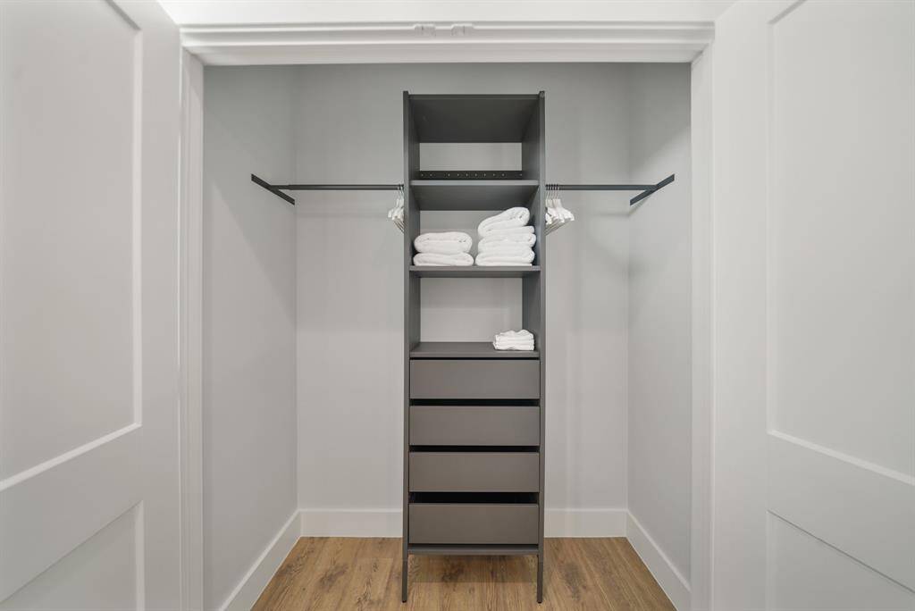 The primary closet has plenty of storage space.