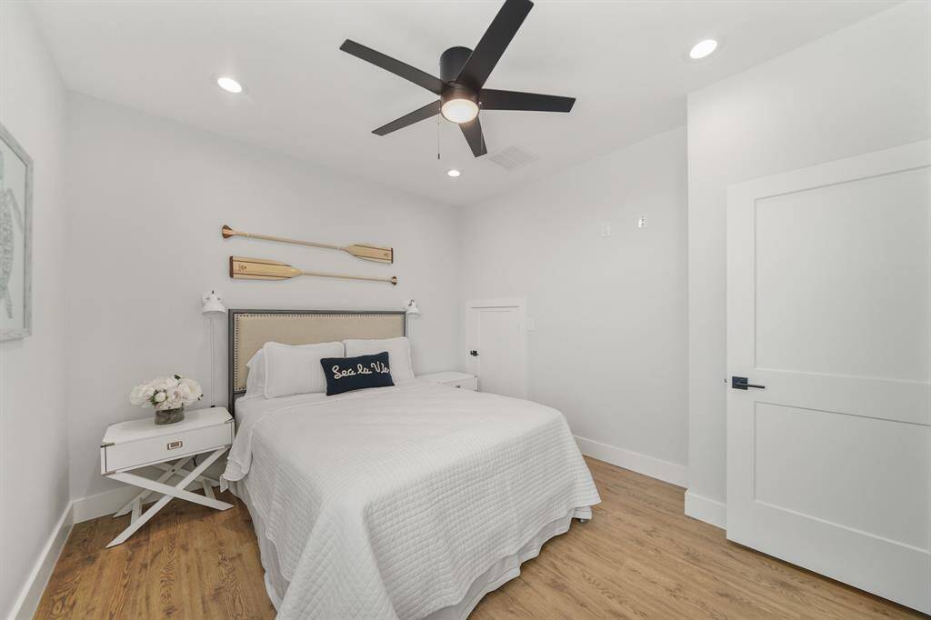 Secondary bedroom features awindow and ceiling fan.