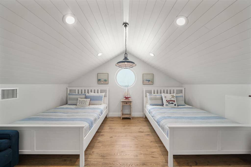 Third bedroom features awindow, high ceilings, and recessed lighting.