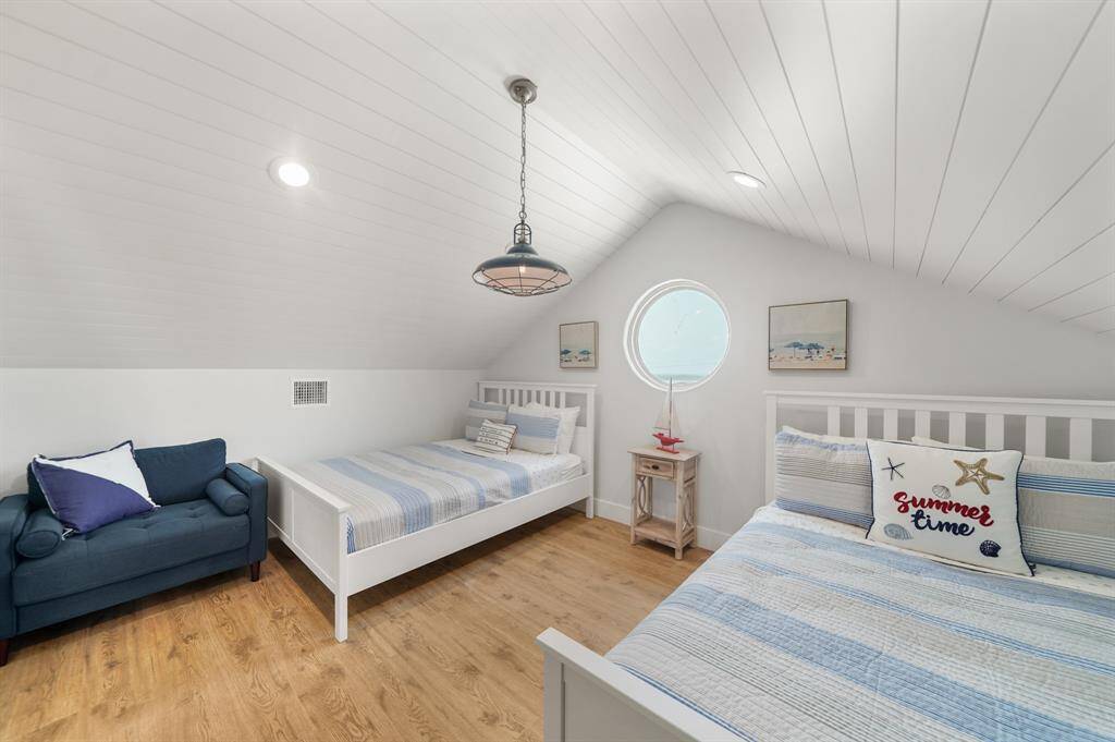 Third bedroom features awindow, high ceilings, and recessed lighting.