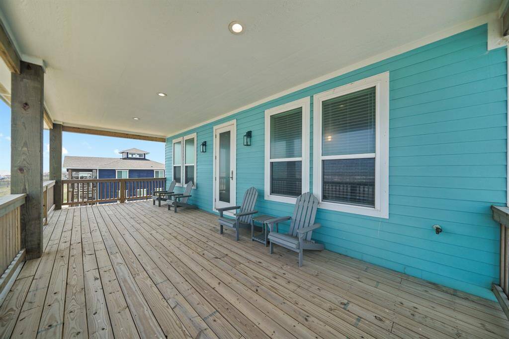 Enjoy the wind off the sea while relaxing on the covered balcony.