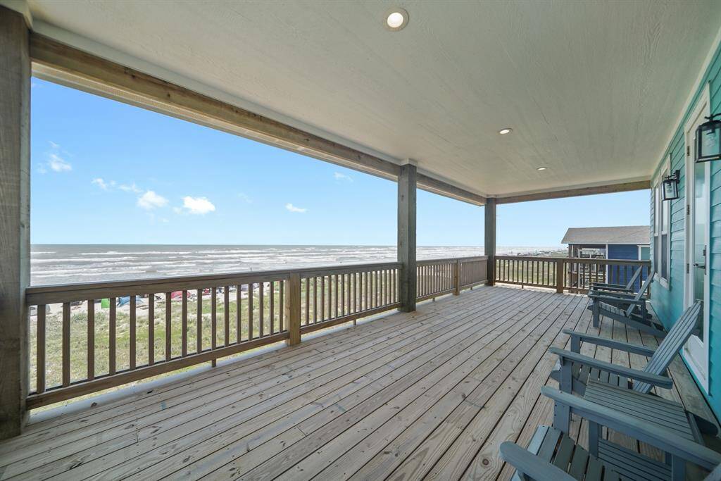 Enjoy the wind off the sea while relaxing on the covered balcony.