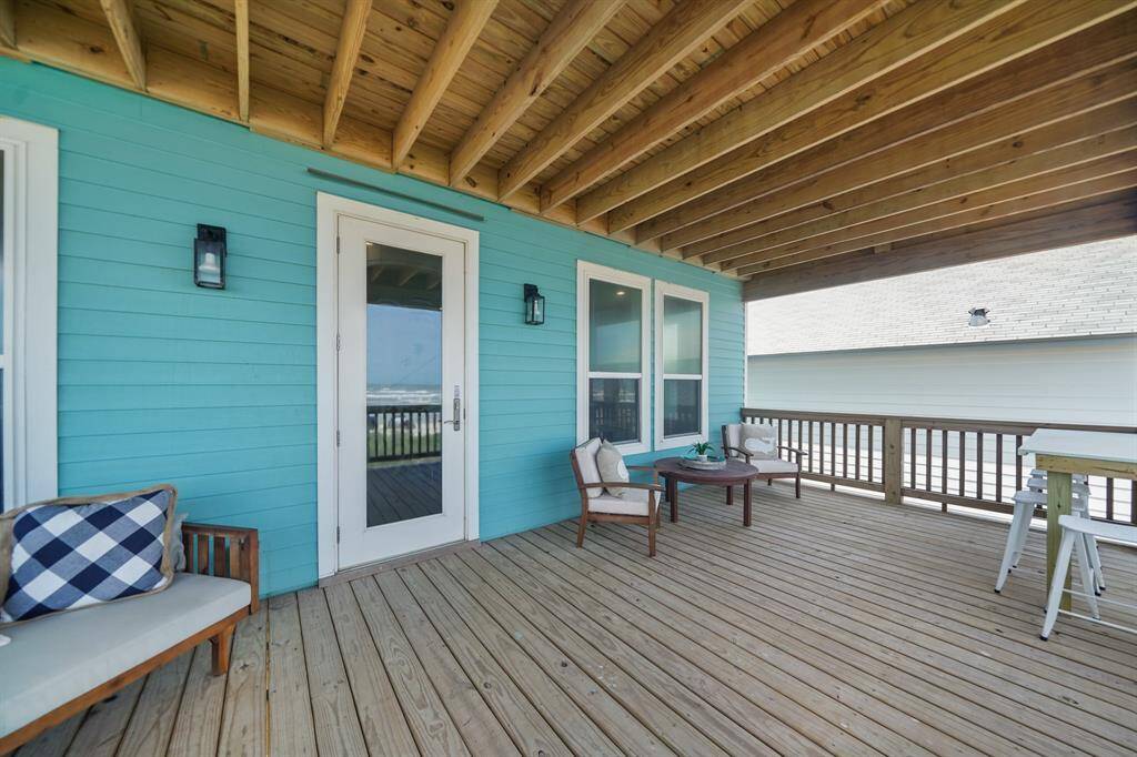 The covered balcony overlooks the ocean!