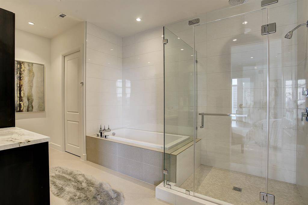 Master Bathroom has double Sinks, Separate Shower, Soaking Tub.