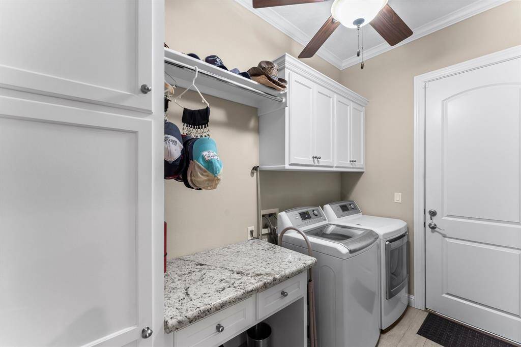 Main floor laundry room with additional storage