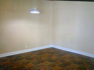 Den with french doors leading to screened in back porch