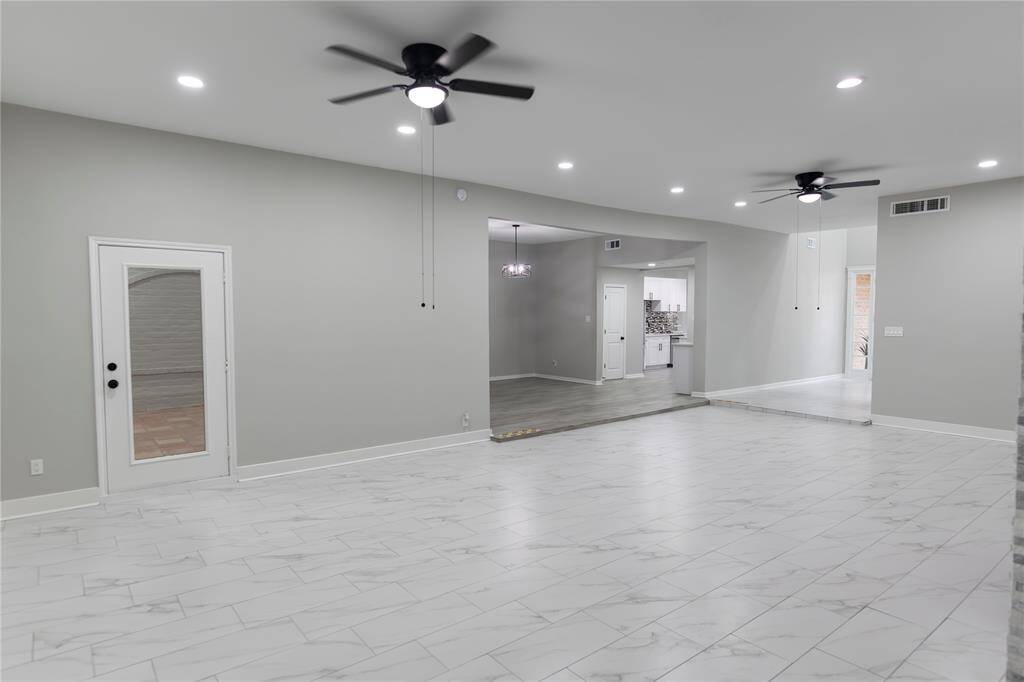 Grand living room with ballroom-style space.