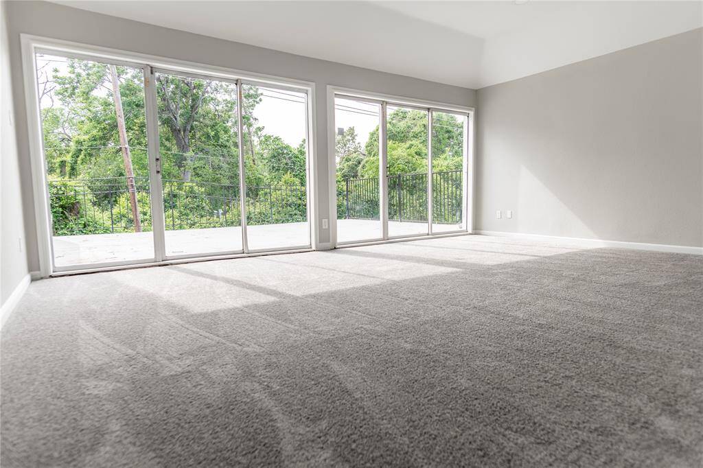Primary bedroom with private balcony is a luxury retreat, designed to maximize natural light.