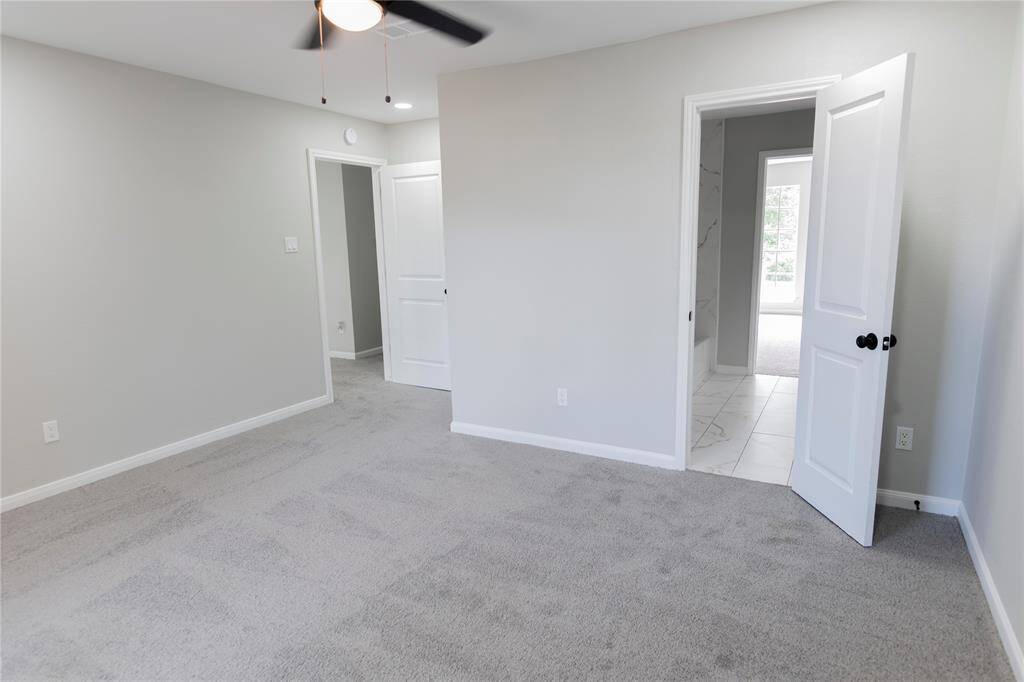 Bedroom with large window.