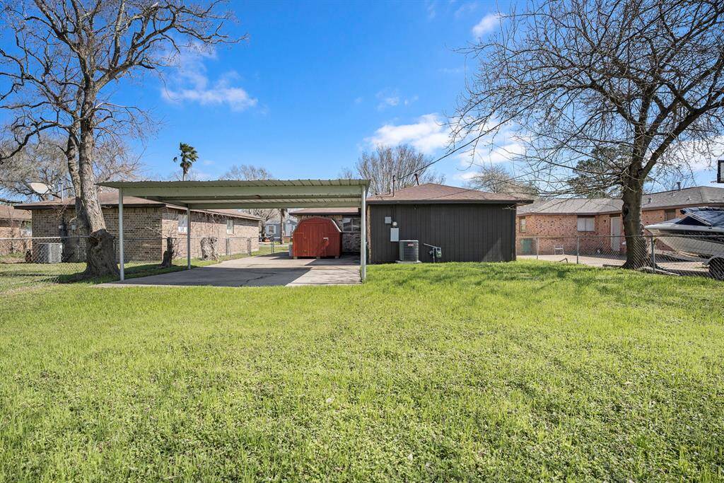 VIEW OF BACKYARD AND STORAGE BUILDING