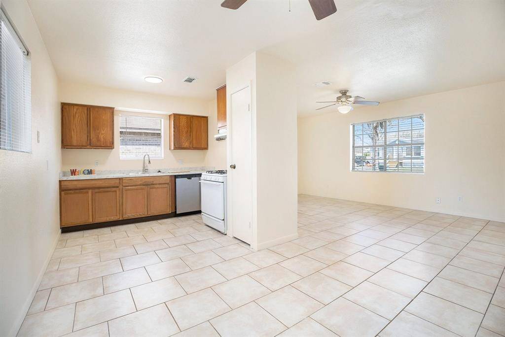 VIEW OF FAMILY ROOM, KITCHEN AND DINING AREA