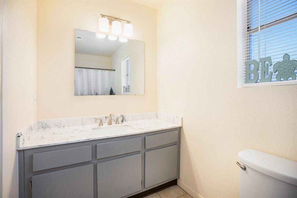 PRIMARY BATHROOM WITH NEW VANITY TOP AND FAUCET