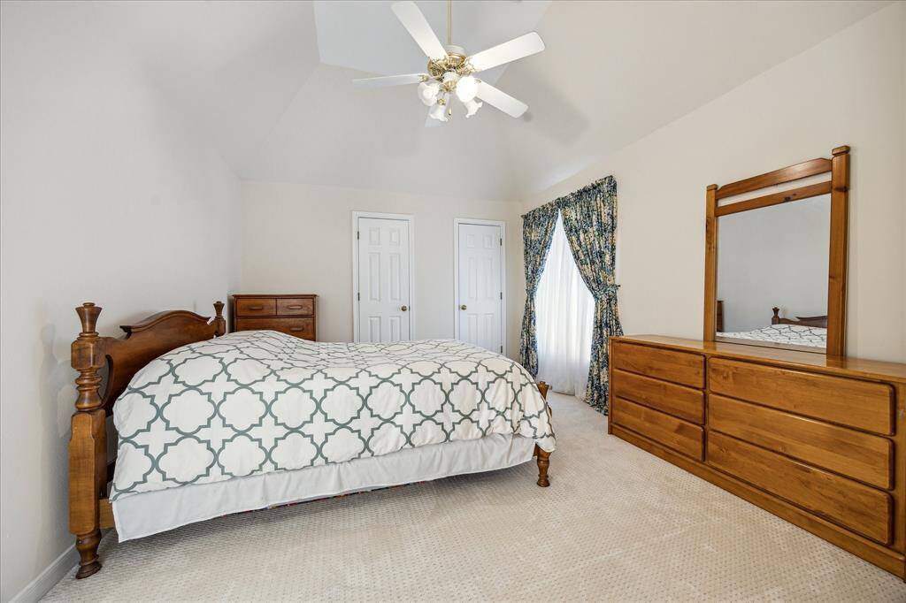 This Hollywood bath features a dual-sink vanity, private shower area, and direct access from two separate bedrooms.