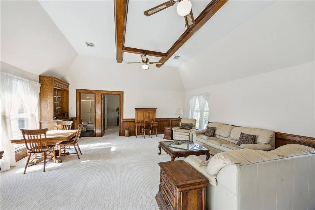 Spacious game room also includes a wet bar, storage, high ceilings, and more!