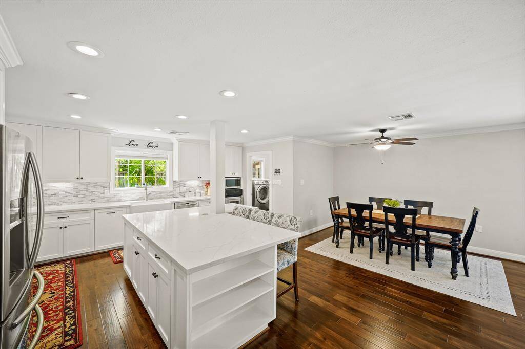 This Chef's Kitchen also offers Open Shelves (for Storage of Cookbooks, etc.) at the end of the Island/Breakfast Bar.