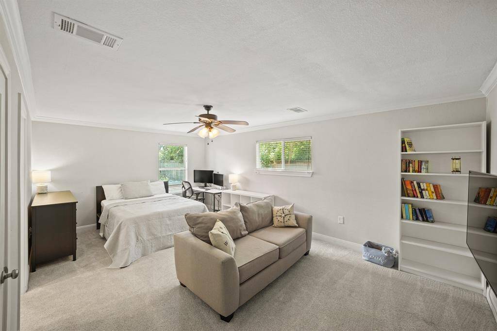The Fourth Bedroom/2nd Primary Suite/Gameroom/Flex Room is Approximately 22'11" x 22'2" and offers Faux Wood Blinds, Extended Baseboards, Light Grey Designer Paint, and a Walk in Closet (Approximately 5'9" x 4'9") with Built in Shelves and Multiple Hanging Rods.