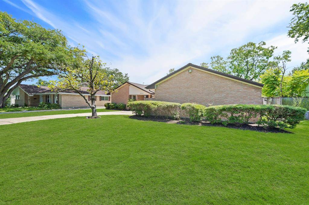 This Magnificent Home features Lush Landscaping in the Front Yard that adds to the Curb Appeal of the Property.