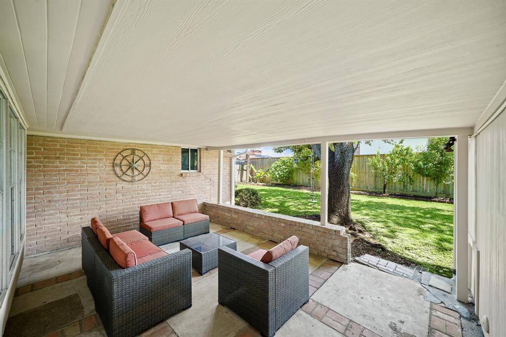 The Backyard Patio (Approximately 17'11" x 12'8") offers a Poured Concrete Patio with Brick Inlay Design, Decorative Brick Accent Wall (Height of Approximately 1'9").  The Brick Accent Wall could be used as an Additional Seating Area, Display of Potted Plants, etc.
