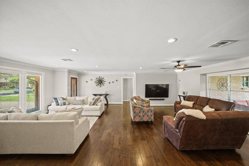 The Living Area/Den also features Crown Molding and Faux Wood Blinds.  The Area offers Many Options for Placement of Furniture.