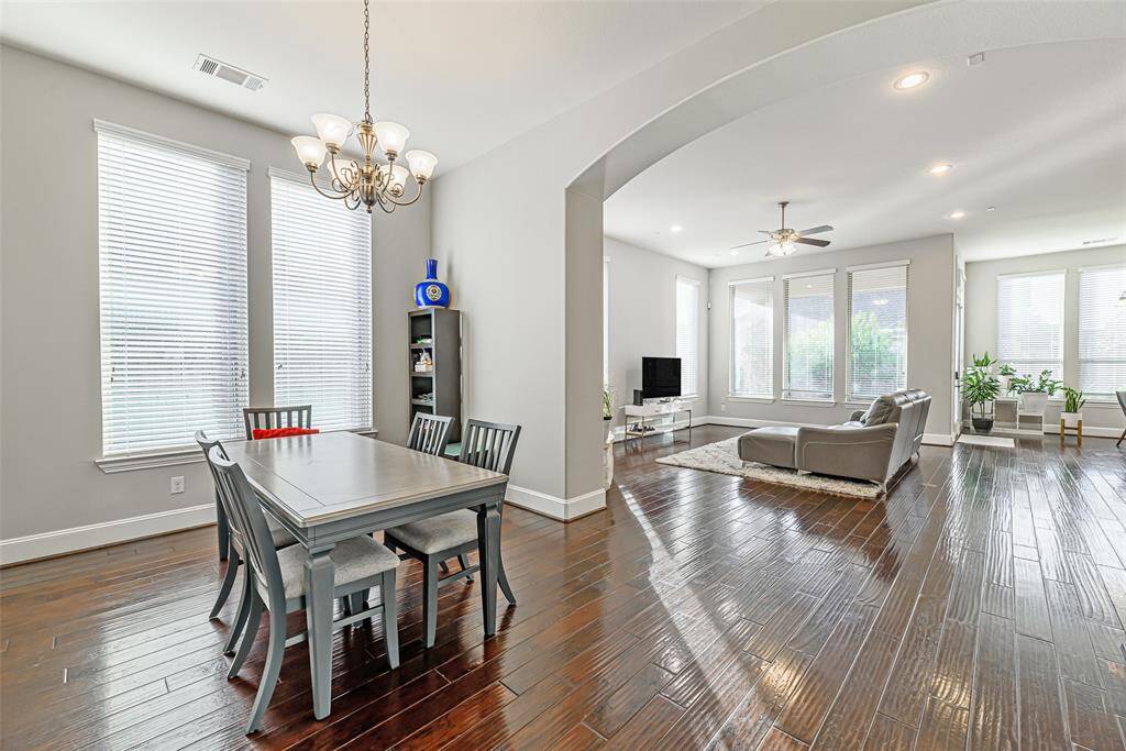 Formal living room with 14' ceilings, wood floors, and plenty of natural lights