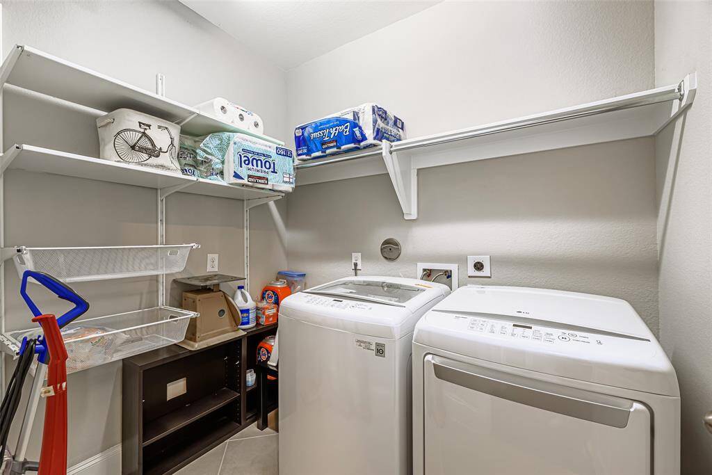 Utility room in the house with built-in shelves. Washer and Dryer aren't included.