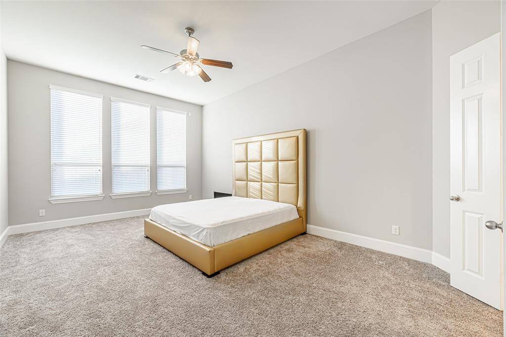 Extended primary bedroom, 21x14, 14' ceilings with carpet flooring. Carpet has been shampooed and deep cleaned recently.