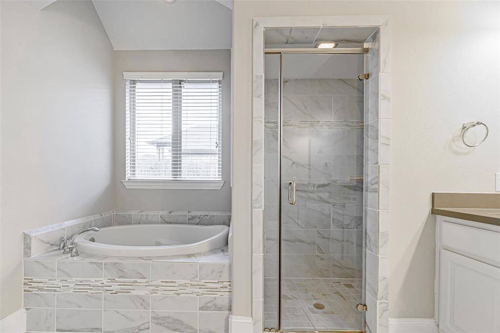 Soaking tub and standalone shower.