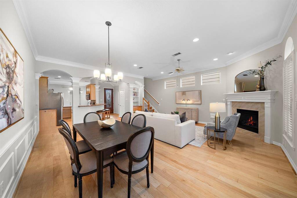 Enjoy effortless entertaining in this expansive layout where the dining and living zones connect seamlessly to the kitchen, foyer, and outdoor retreat.