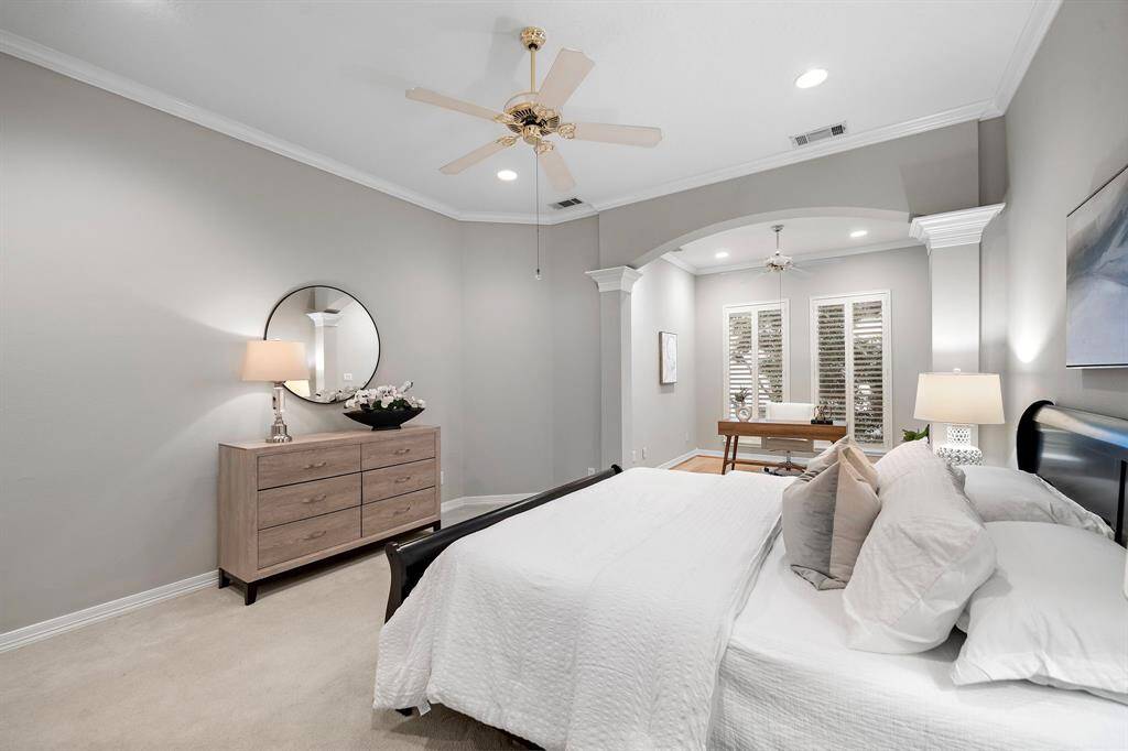 Graceful archways and column details frame the sleeping area and connect seamlessly to a flexible sitting nook or office retreat.
