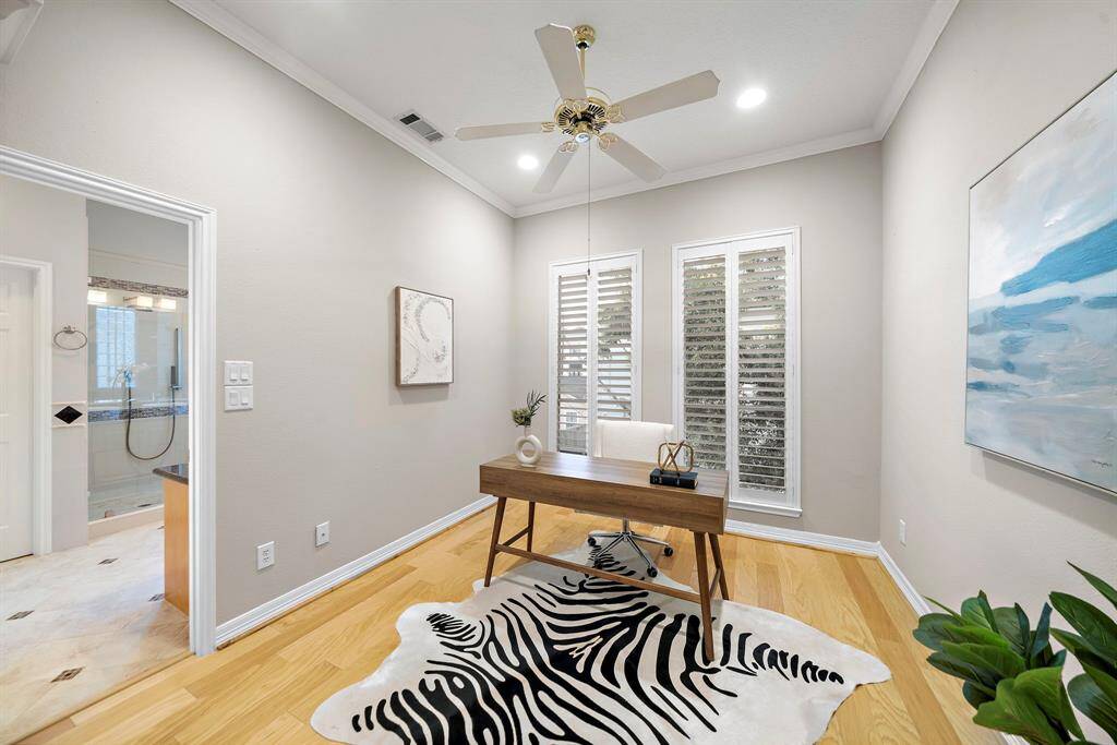 With privacy doors and natural light pouring through plantation shutters, this flexible space delivers the perfect work-from-home setup or serene escape.