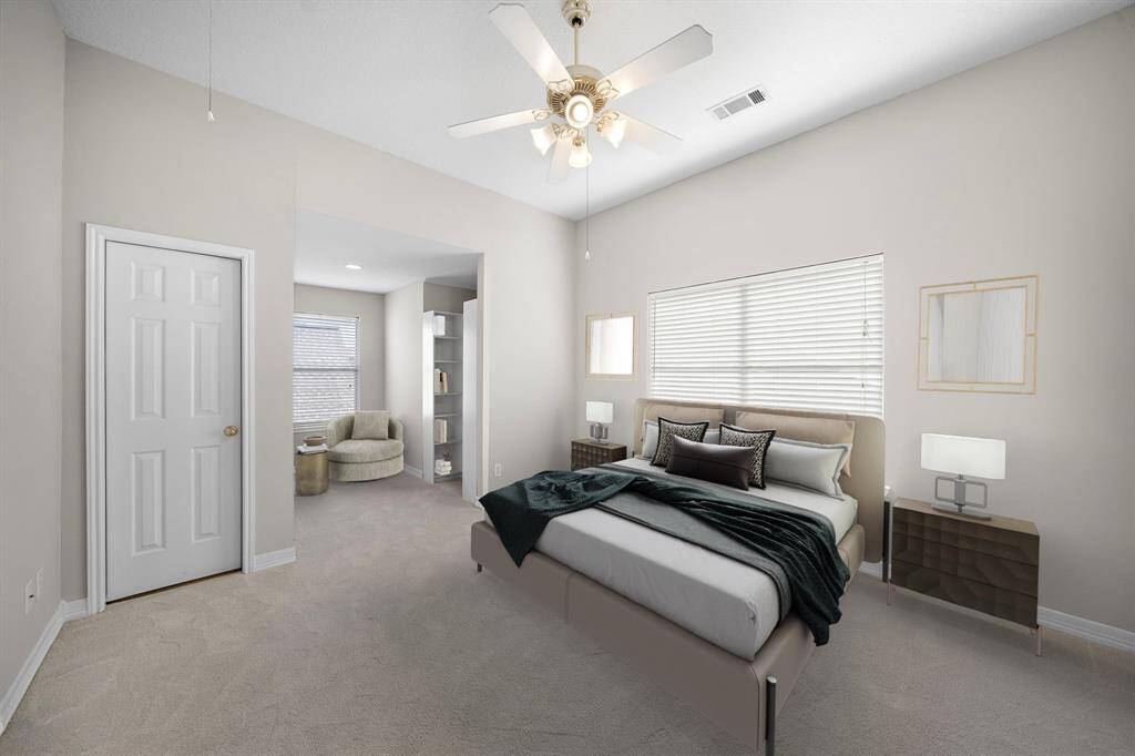 Soft natural light and a neutral palette make this secondary suite feel bright and versatile—whether used as a guest room or home office. This photo has been virtually staged.