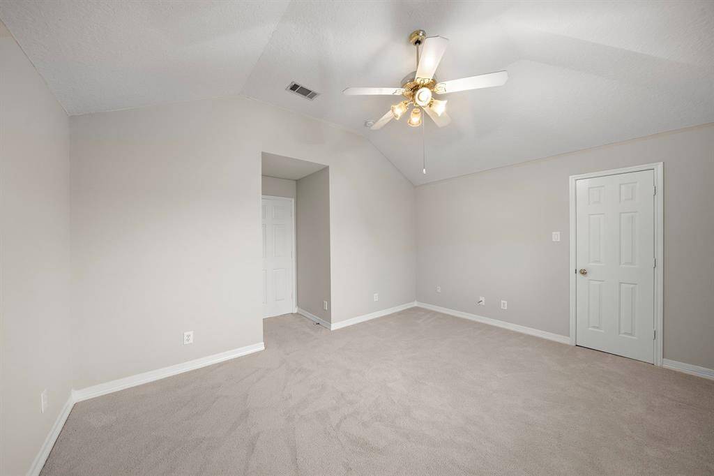 Positioned just off the hallway, this spacious bedroom offers great layout potential and closet space for everyday ease.