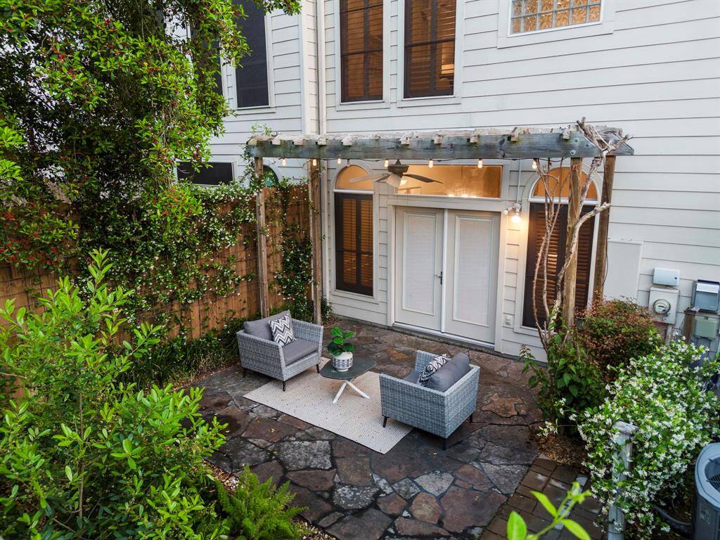 A lush vantage reveals the full scope of the landscaped backyard, designed for low maintenance and everyday tranquility.