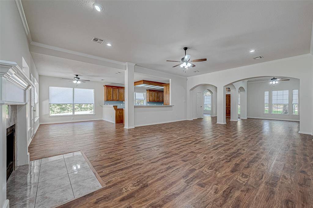 Huge den with plenty of wall and floor space for tvs and furniture