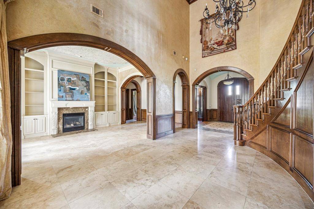 Just across from the study is a formal sitting area with gas log fireplace.