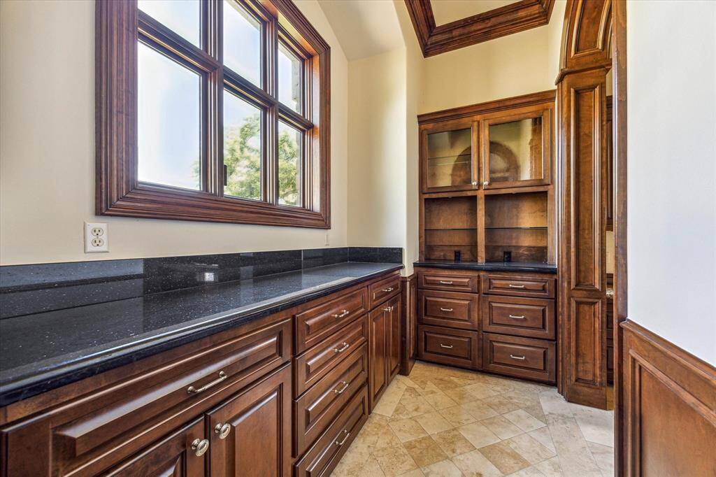Additional side of the butler's pantry, perfect for storing extra dishes.