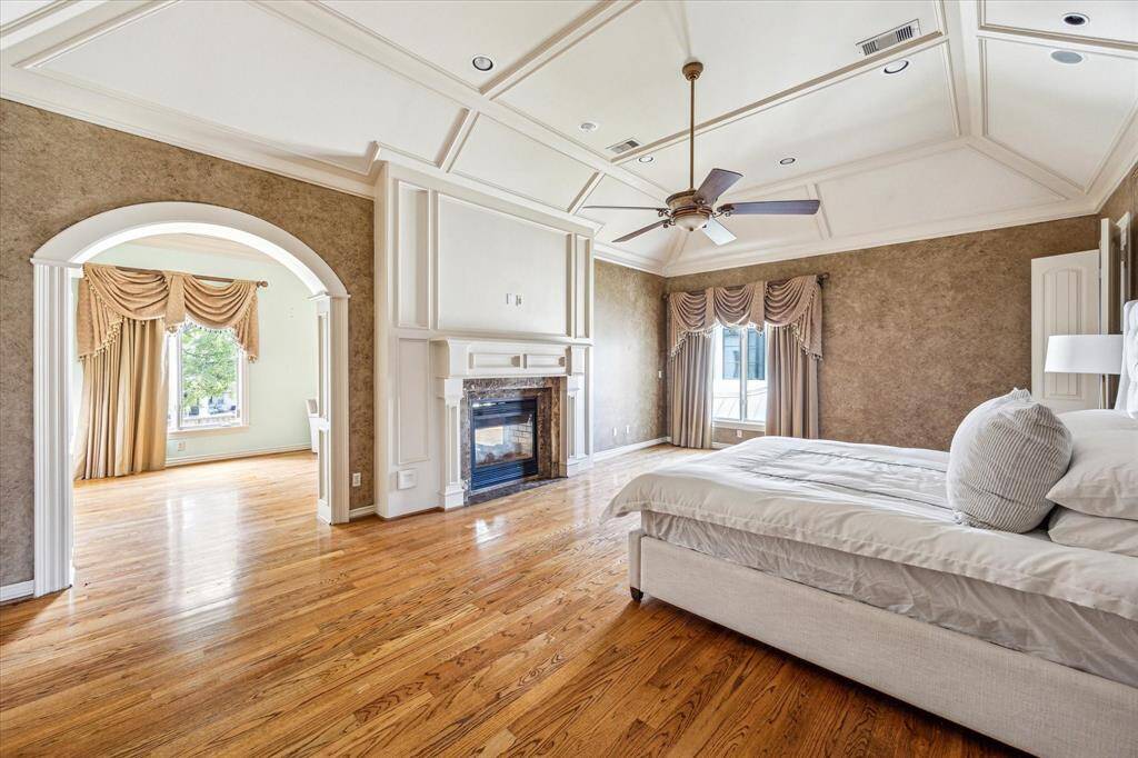 The sprawling primary bedroom, looking toward the sitting area.