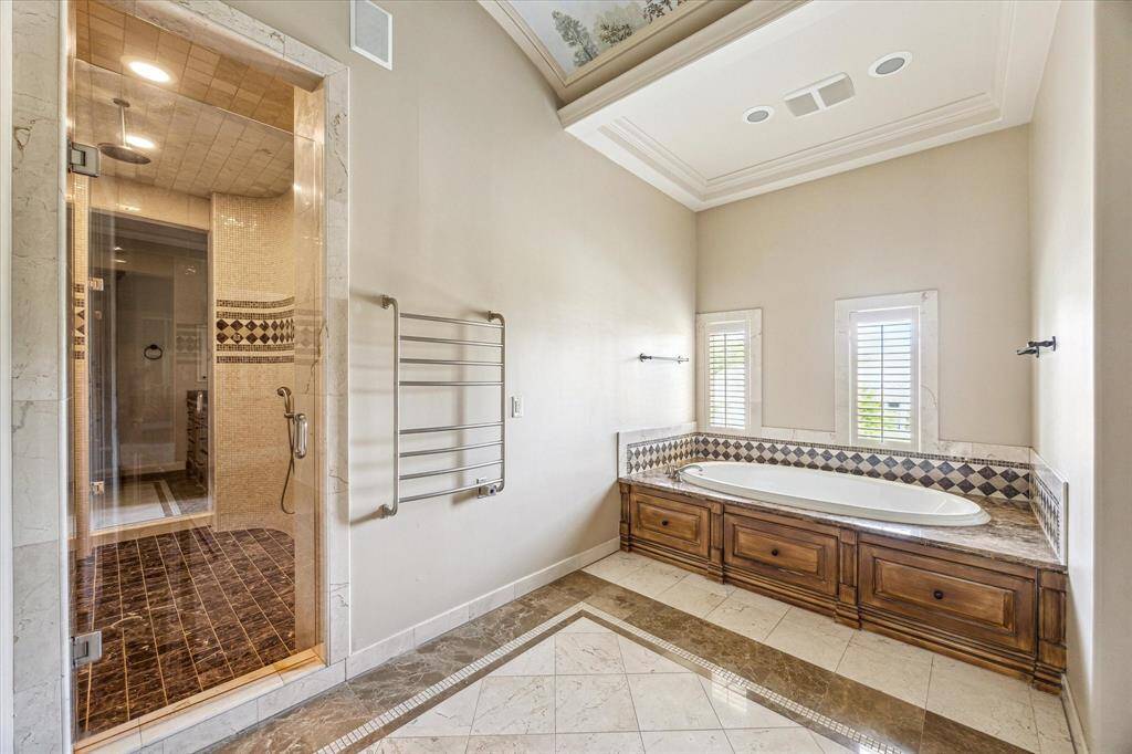The soaking tub with towel warmer.