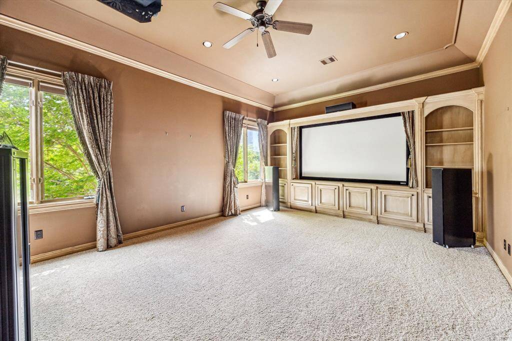 This media room is located off of the game room and features a full, en suite bath. This could be another bedroom if needed.