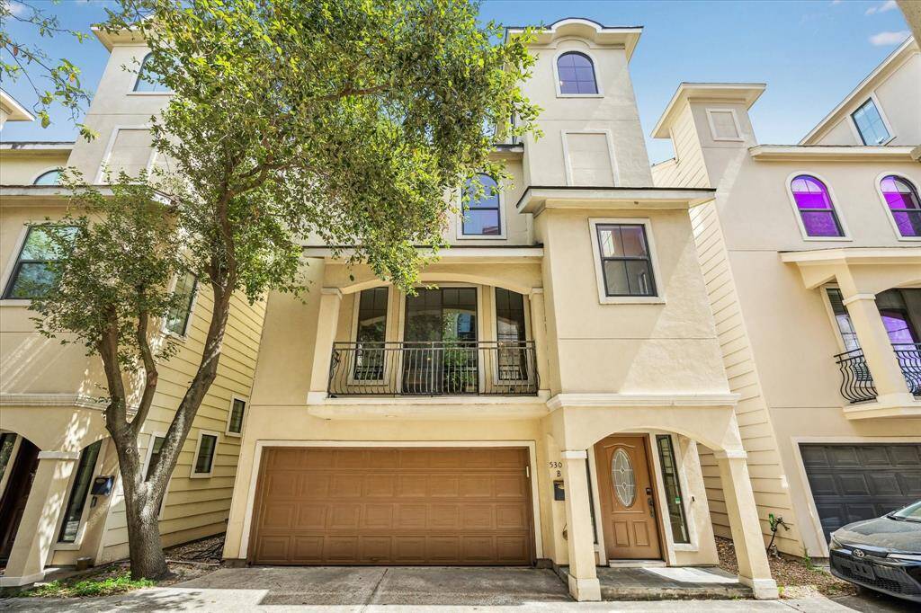 This impressive townhome is tucked into a private drive and in an ideal location.