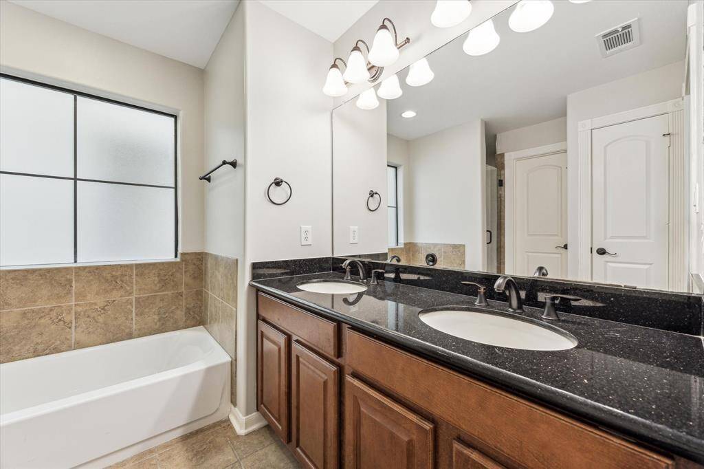 Double vanity & shower/tub combo.