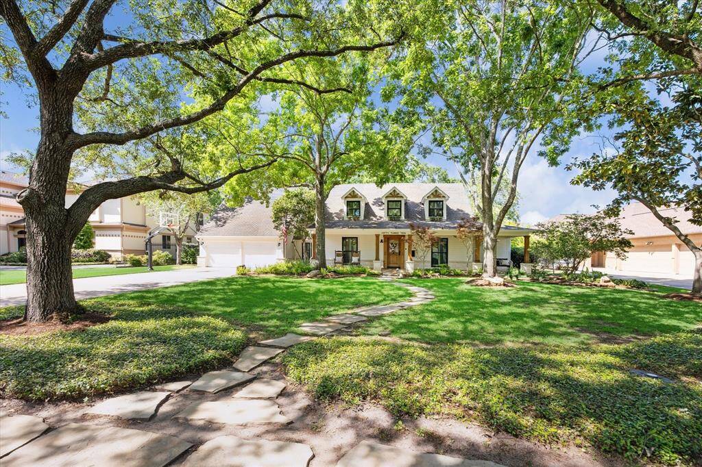 Charming 1940's home that has been extensively updated and situated on an 18,000 sq ft lot in Bellaire.  Features a spacious front yard with a stone pathway, creating a serene and inviting atmosphere. Perfect for families seeking a picturesque setting.