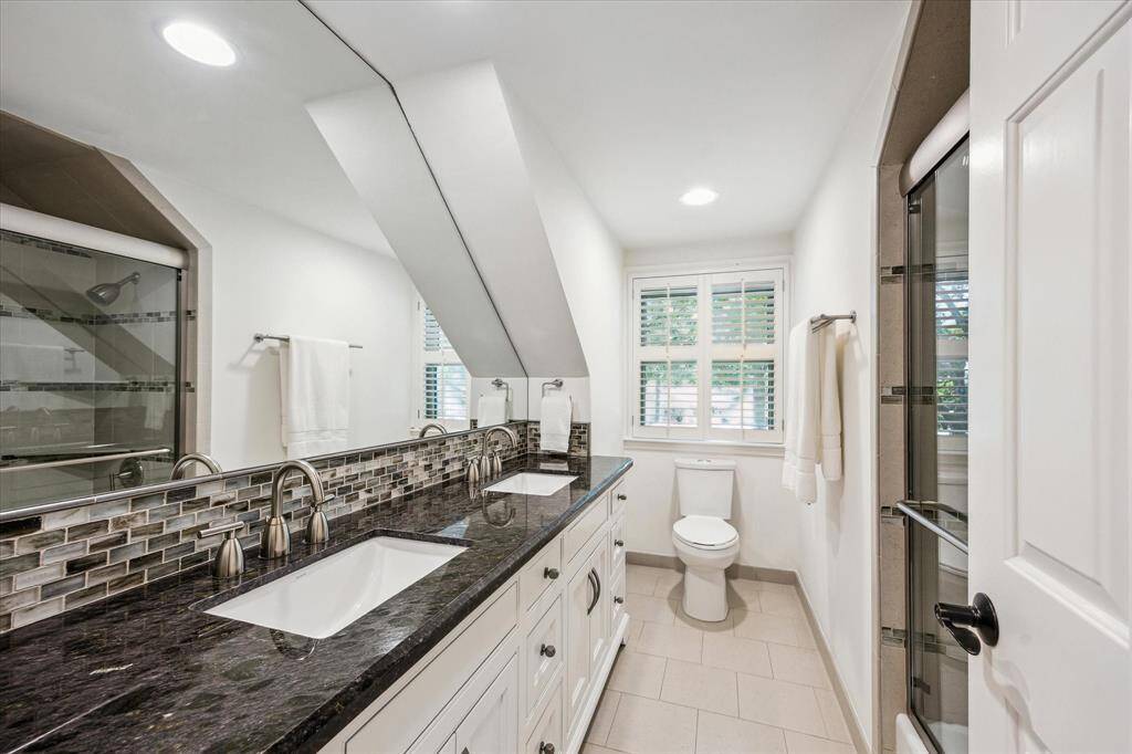 Bathroom with duel sinks for bedroom 3 and 4.