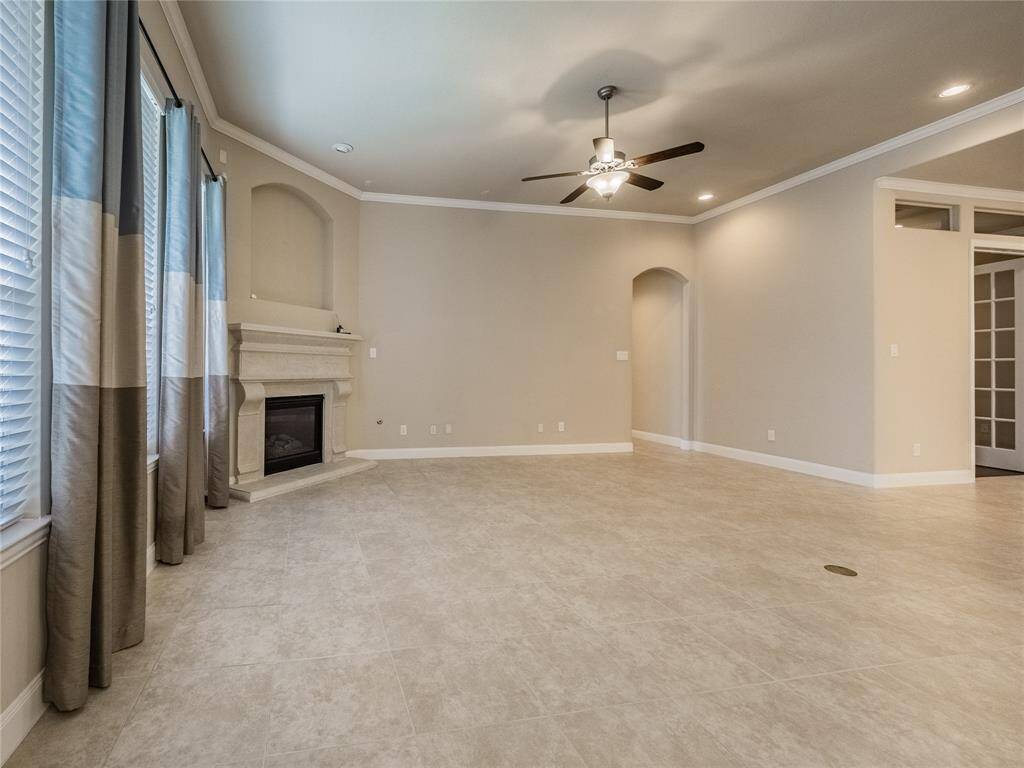 this view of the family room you can see the entrance to the primary bedroom and the location of the home office