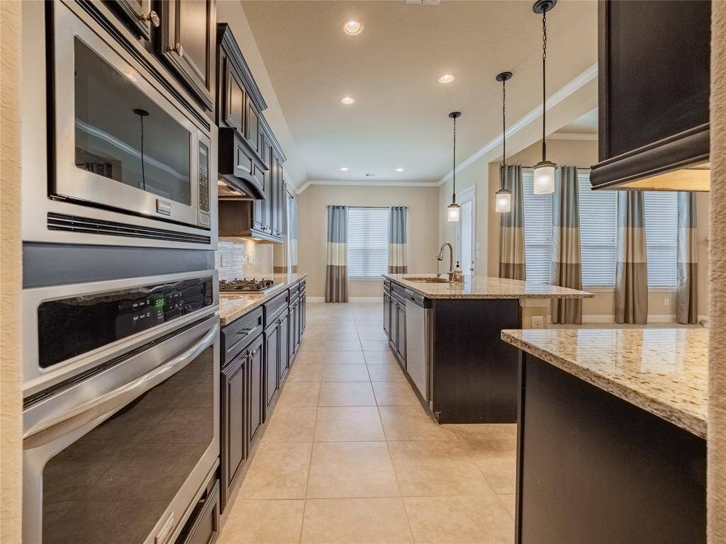 from here you can see how the kitchen  seamlessly flows to the family room and breakfast nook
